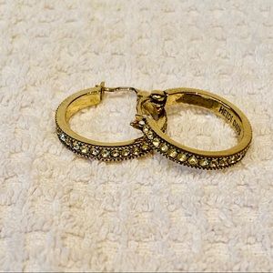 Heidi Daus 1 inch light limon colored crystal earrings set on Heidi Daus bronze